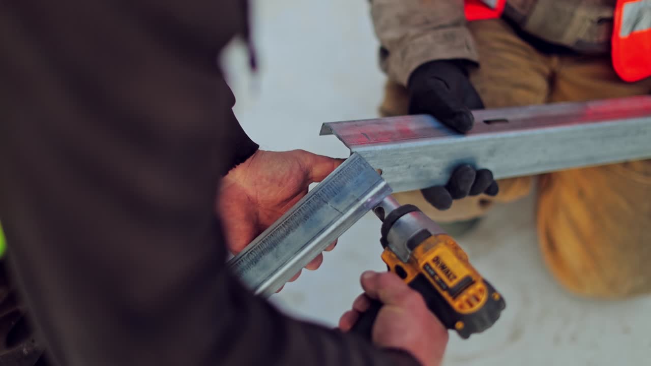 Installing Of Solar Cell. Solar panel technician with drill installing solar panels