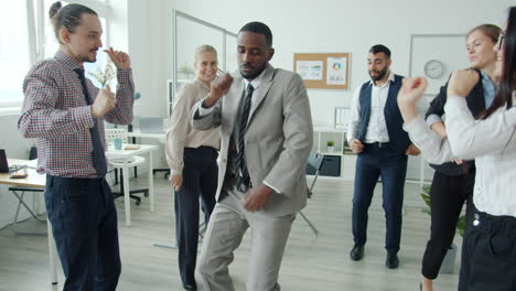 happy office team dancing