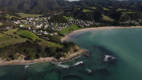 Scenic-aerial-orbit-reveal-of-New-Zealand-coastal-settlement-in-Northland
