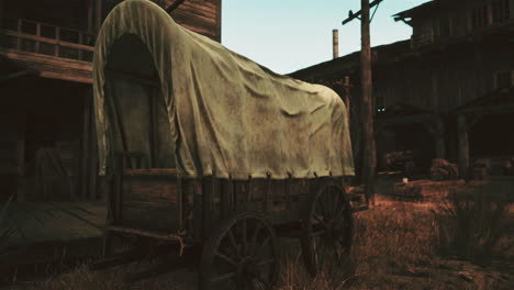 a covered wagon in a western town