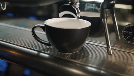 coffee machine on a wooden table slow motion