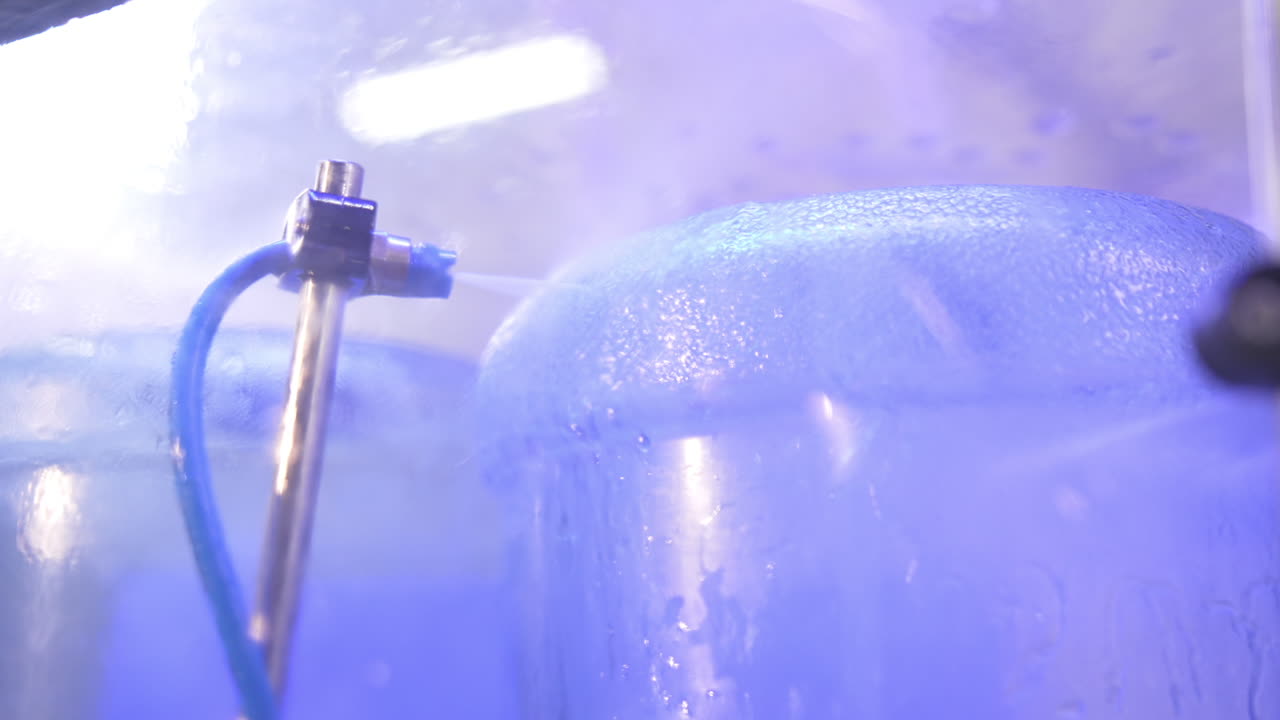Packing materials for fresh water being washed and prepared for to be filled with water. Close up. Water in bottles production.
