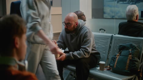 airport passengers waiting and eating