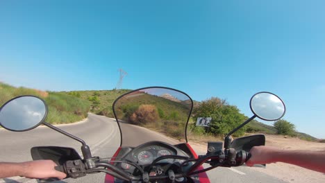 riding a motorcycle on penteli mountain in greece