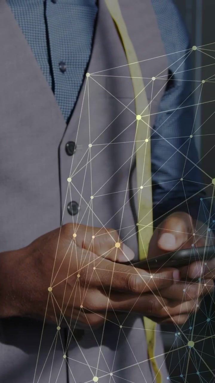 Vertical video: Man using phone tapping swiping network graphic shifting diagonally for tech review