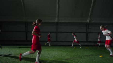 female soccer players training indoors