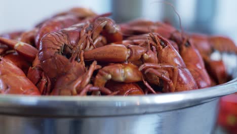 Red-fresh-crayfish-freshwater-lobsters,-seafood-in-steel-pot-ready-to-be-cooked-in-professional-kitchen-restaurant-for-delicious-expensive-healthy-meal