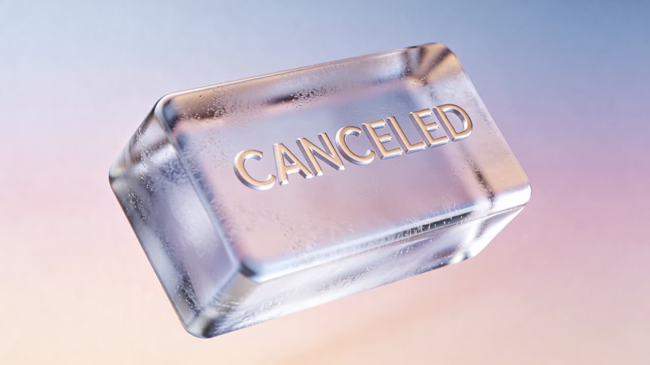 Playback starting rotating frosted block with bevels revealing embossed CANCELED on pastel backdrop