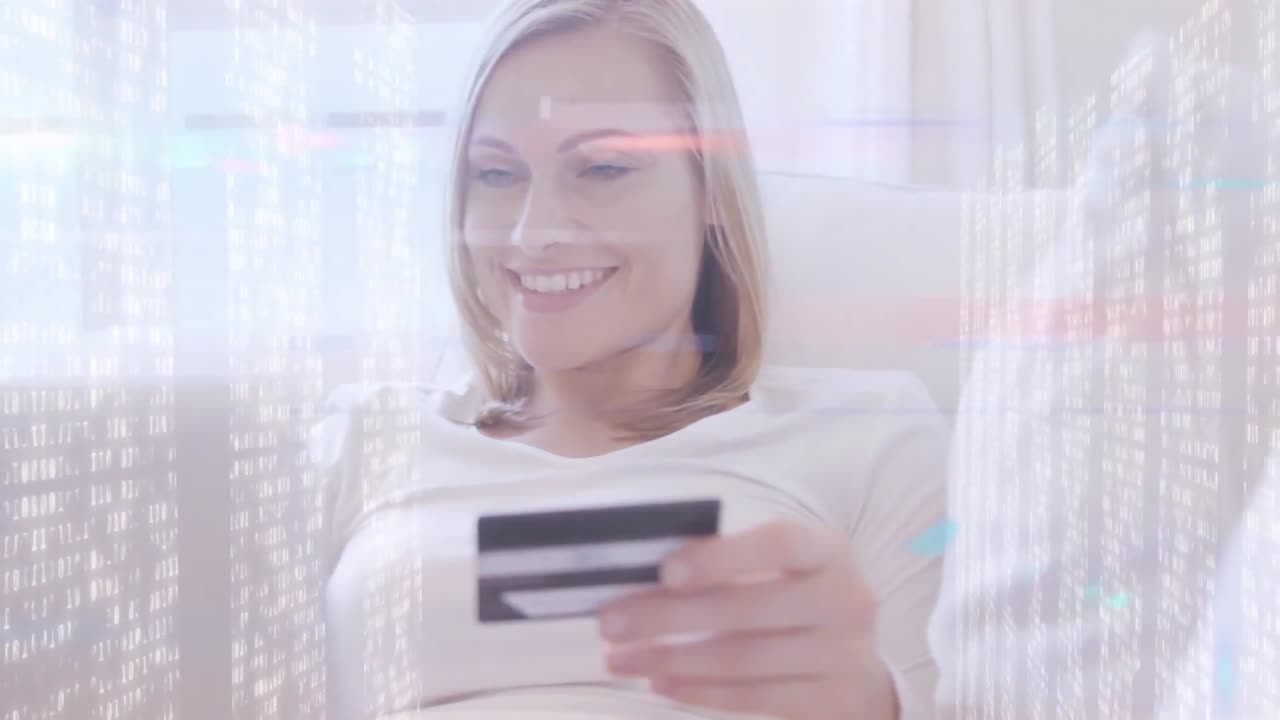 animación de pantallas de cuadrados de mosaico sobre mujer caucásica con tarjeta de crédito usando portátil en casa.