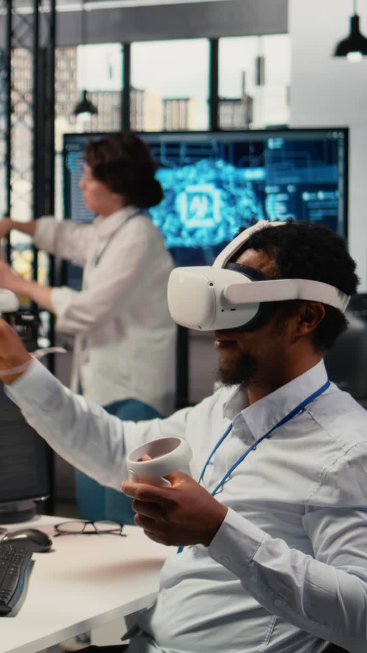 Vertical video Programmer in office using virtual reality tech to fix hacking attempt