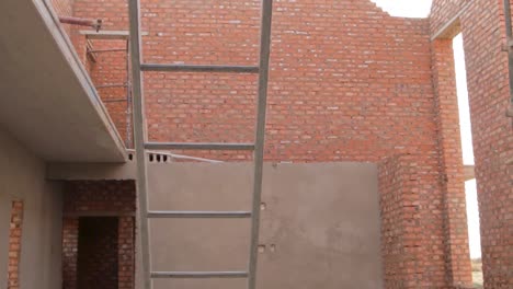 pan and tilt of new house construction with ladder and scaffolding