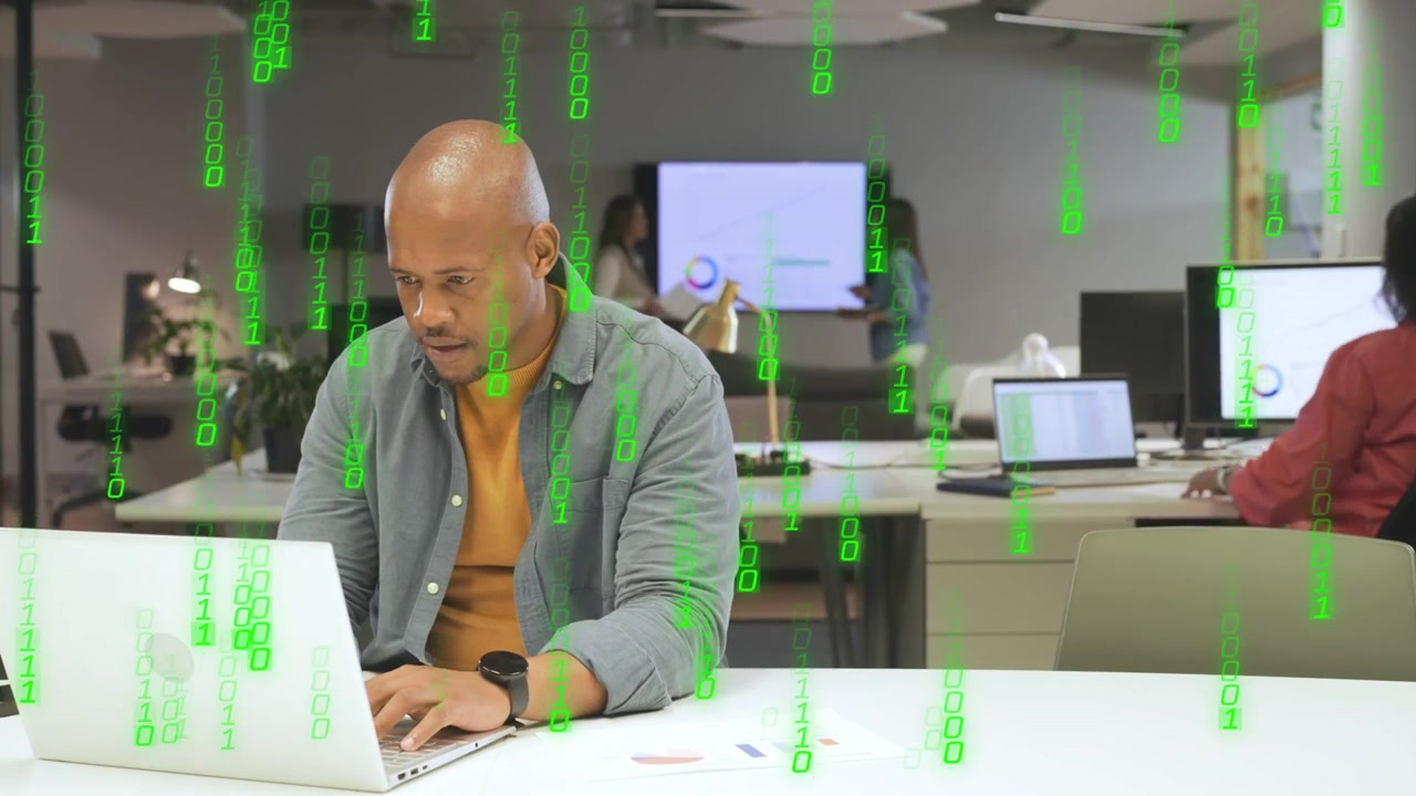 Office man glancing at laptop, typing and reading docs, causing green code overlay during business