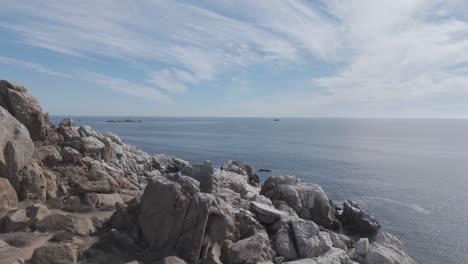 drone shot near coquimbo chile south america on a blue sky day flying above fort lambert near the sea and rock formations tourist place log
