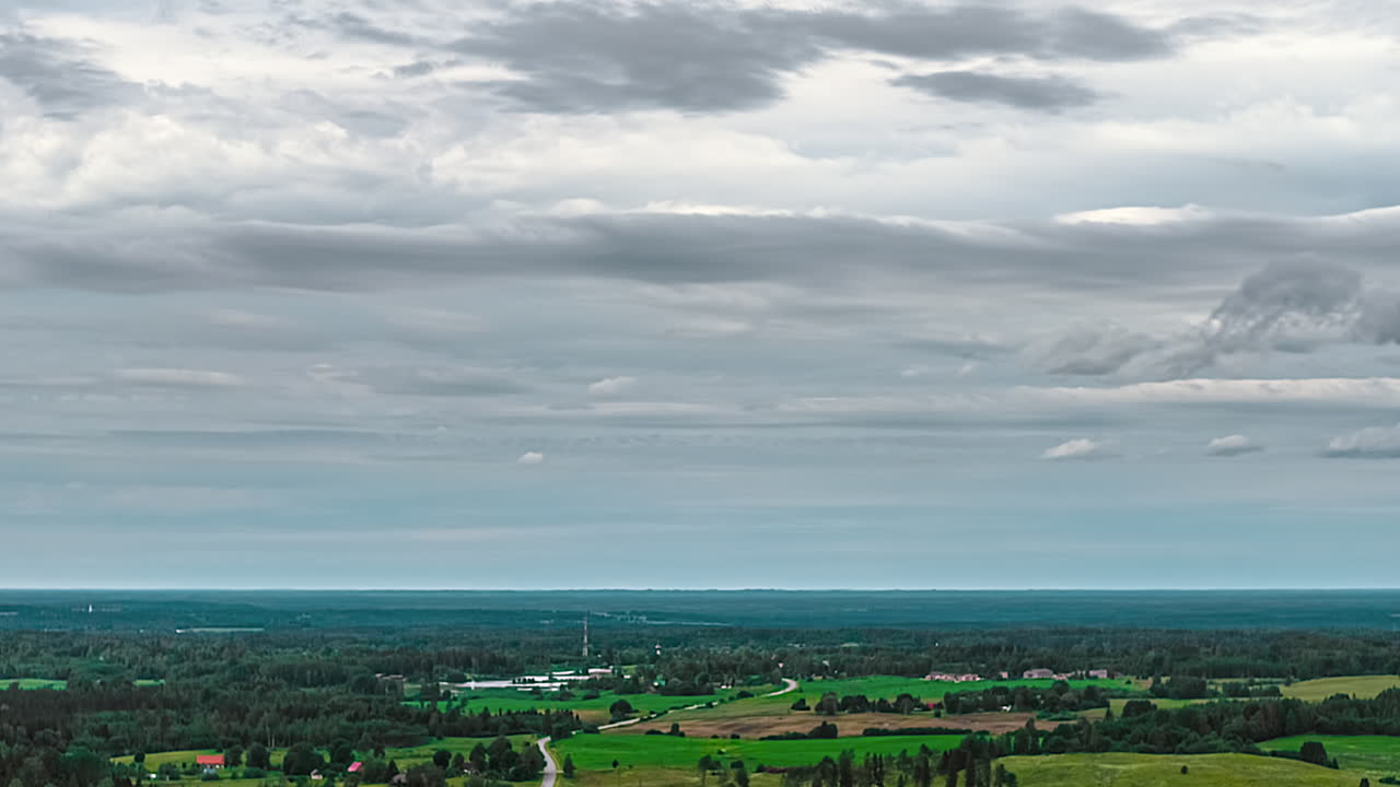 Fast-paced rural landscape with dynamic clouds in hyperlapse format