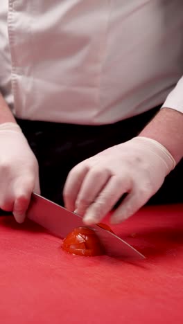 chef preparing sliced tomatoes