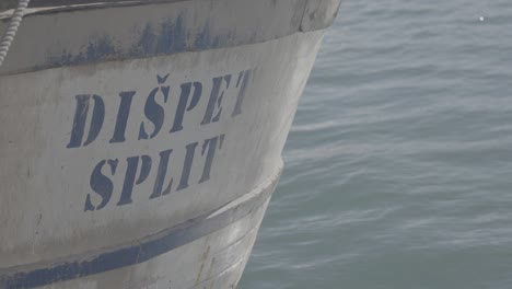 an old fishing boat anchored in the harbor