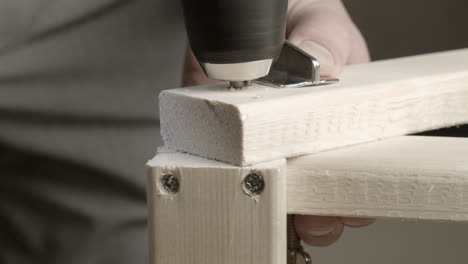 screw holes drilled into pine lumber for home construction project