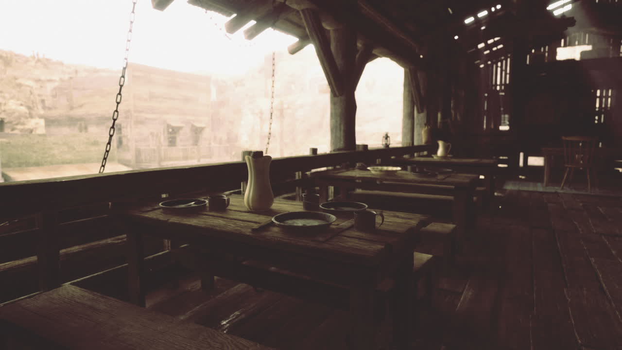 Rustic interior dining area with wooden tables and simple dishware
