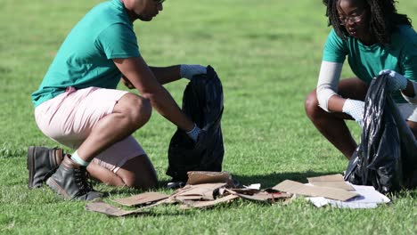 volunteers picking trash in bags