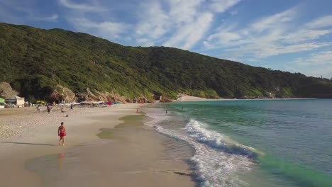 beautiful beach with people enjoying leisure time on the arraial do cabo region in brazil