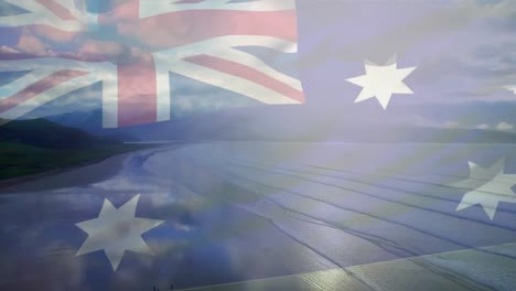 Digital-composition-of-australia-flag-waving-against-aerial-view-of-waves-in-the-sea