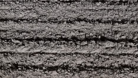 a closeup of the soil at the dirt race track, commonly utilised for horse racing events worldwide