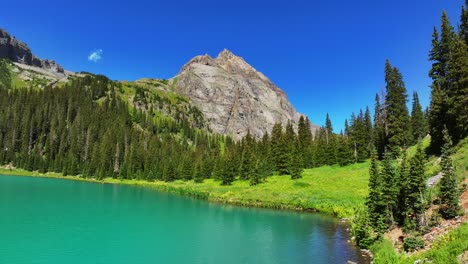 bright sunny lower blue lakes mount sneffels wilderness drone forward pan up summer ridgway telluride colorado rocky mountains uncompahgre national forest san juan dallas range hiking trail left mot