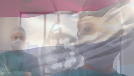 수술실에서 외과의사 위에 흔들리는 네덜란드  ⁇ 발의 애니메이션