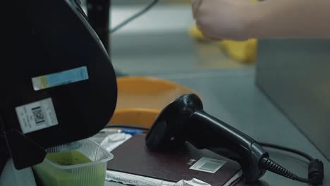 young girl pays for the goods at the checkout 1