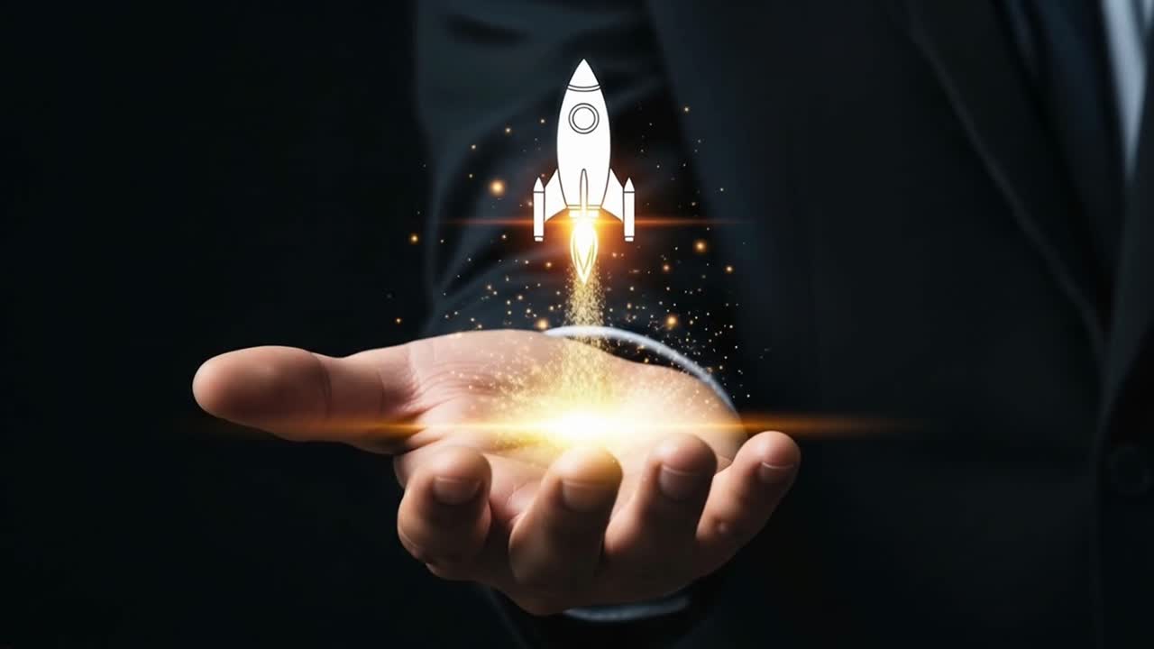 A man is holding a hand up to a rocket