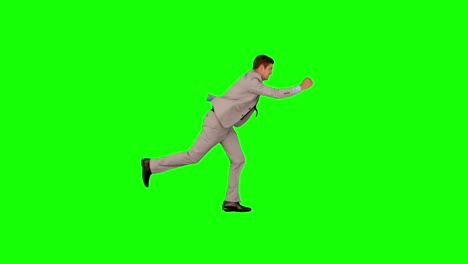 Businessman-running-and-jumping-in-slow-motion