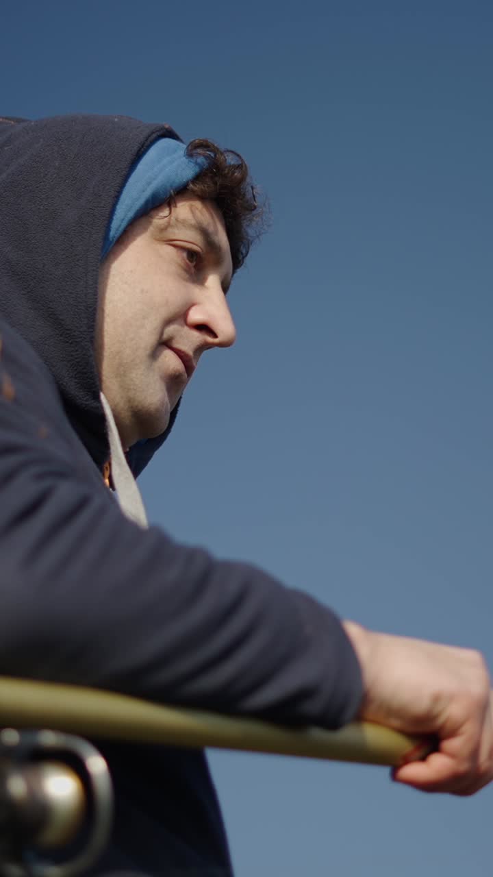 Man in Hoodie Looking at the Sky