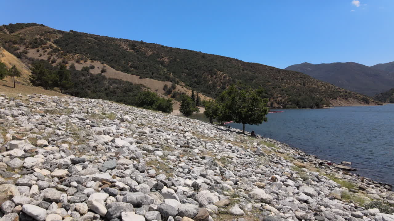 Flying on a drone in 4K, the view of the boats in motion in a lake in California