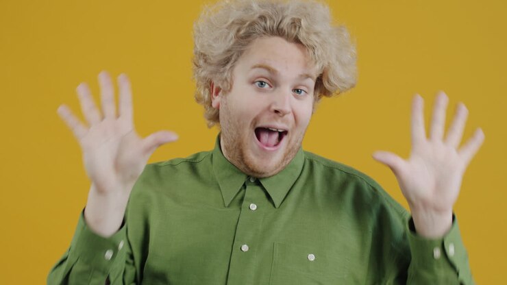 Man Making Heart Shape with Hands