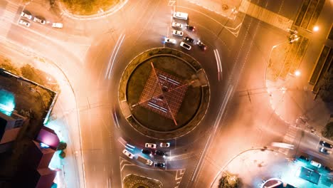 night aerial view of roundabout with traffic