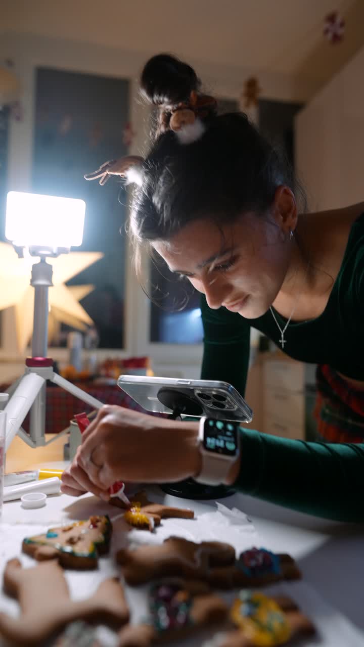 Woman Decorating Gingerbread Cookies