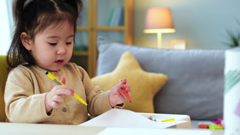 baby drawing sitting on a chair