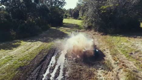 Jeep-Wrangler-mudding-with-a-nice-splash-of-a-puddle