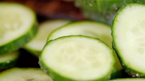 slices of fresh cucumber slowly rotate.