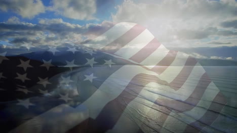 animation of flag of usa blowing over beach landscape