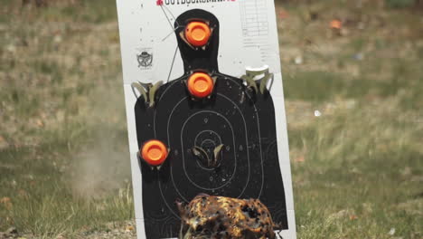 outdoor shooting range target taking hits, being shot at, close up, series