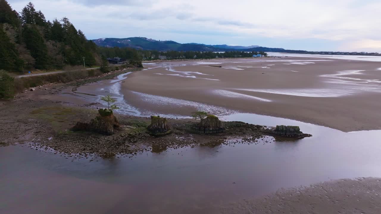 Aerial Drone View of Siletz Bay and the Three Brothers Rock Formation on the Oregon Coast