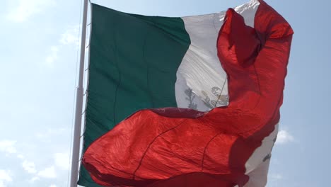 Wrinkled-color-washed-waving-Mexican-flag-moving-with-the-wind-in-slow-motion