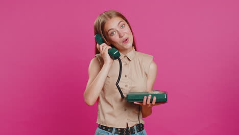 Young-woman-talking-on-wired-landline-vintage-telephone,-advertising-proposition-of-conversation