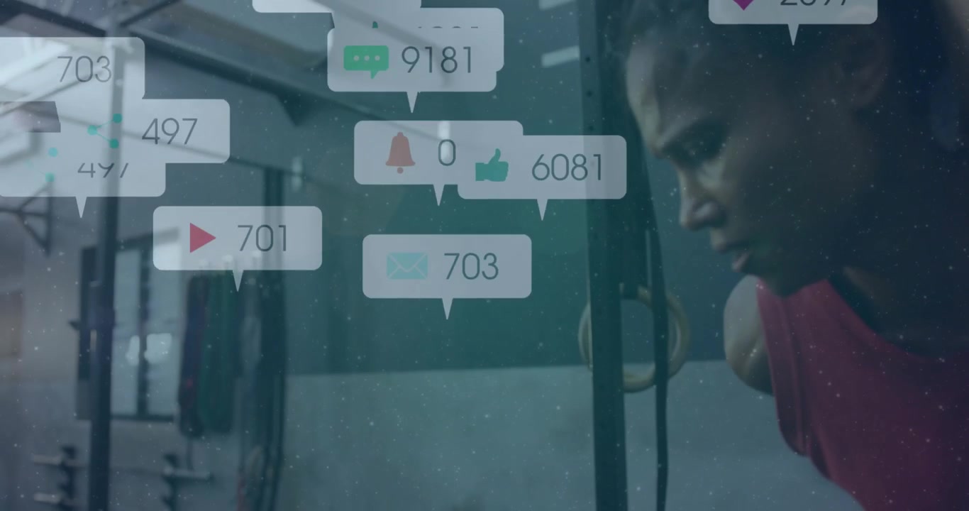 Female fitness athlete leaping parallettes and tracking animated social media engagement metrics