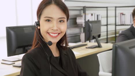 Business-people-wearing-headset-working-in-office