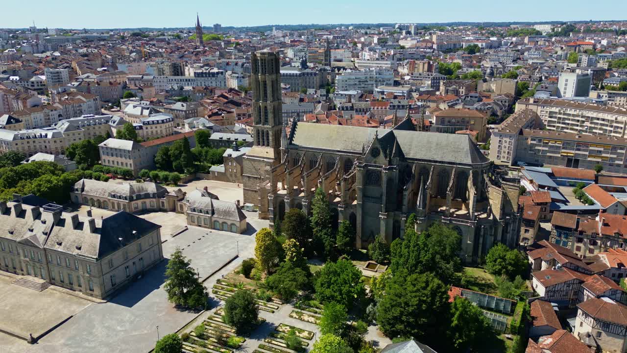 Dynamic panning drone view showcasing the magnificent Saint-Étienne Cathedral, the surrounding square and Limoges historic cityscape - France