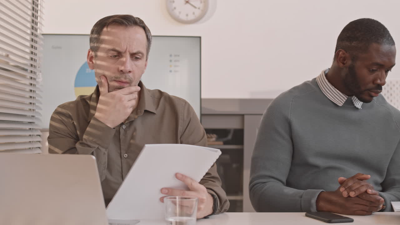 Diverse Colleagues Working at one Desk