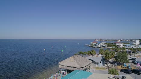 4k drone video of beach bar on hudson beach on the gulf of mexico in florida