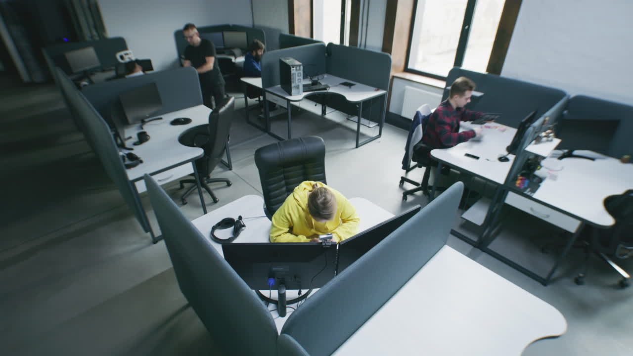 People Working in a Modern Open-Plan Office